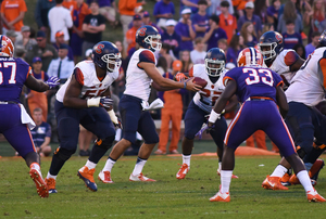 Austin Wilson (center) hadn't appeared in a game all year and wasn't on the two-deep depth chart. But he was the quarterback that came in after starter Eric Dungey left the game with an injury. 