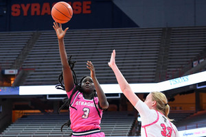 Syracuse forward Maeva Djaldi-Tabdi shoots the ball against NC State. Djaldi-Tabdi and Amaya Finklea-Guity gained increased minutes in the postseason.