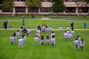 The chairs were organized to match the plane - 33 of the scholars sat where the people they represent did, the other 2 at the front. 