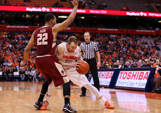 Cooney, in a triple-threat position, tries to create space against Aaron Brown. 