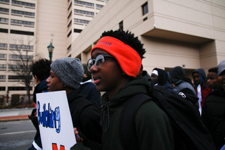 Despite freezing weather, dozens of supporters hit the streets of downtown Syracuse on Friday morning. 