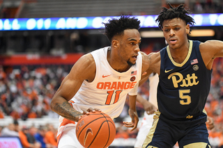 Oshae Brissett drives to the basket on Pitt's Au'Diese Toney. 