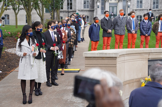 Remembrance and Lockerbie Scholars line up to honor the victim they represent with a speech and lay a rose on the Wall of Remembrance in the victim's honor.