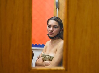 Backstage the models wait to walk down the runway and showcase the fashion. 